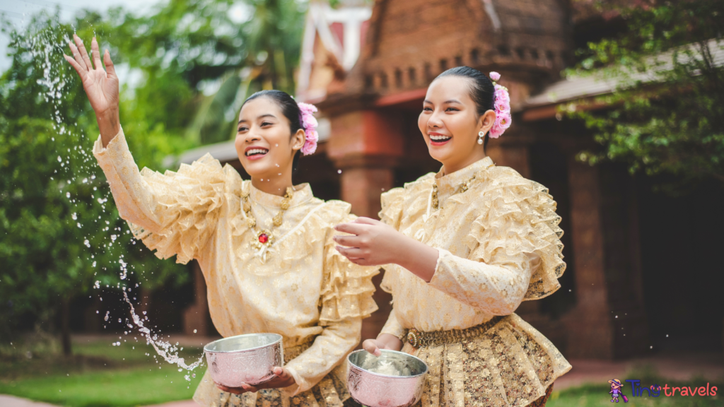 Songkran festival. Northern Thai people in Traditional clothes dressing splashing water together in Songkran day cultural festival