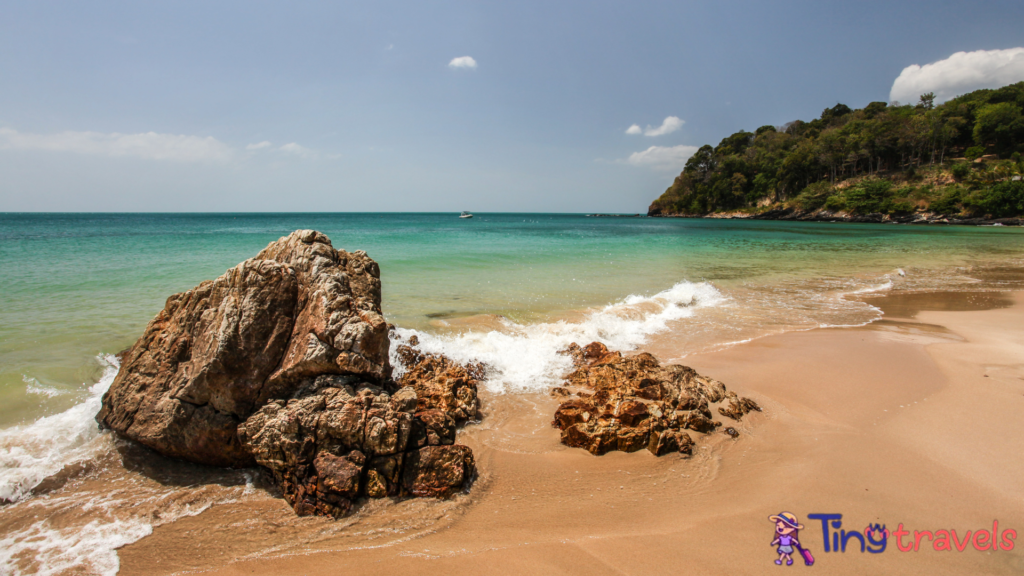 Klong Nin beach, with rocks in foreground and green blue sea in background. Koh Lanta, Thailand⁠