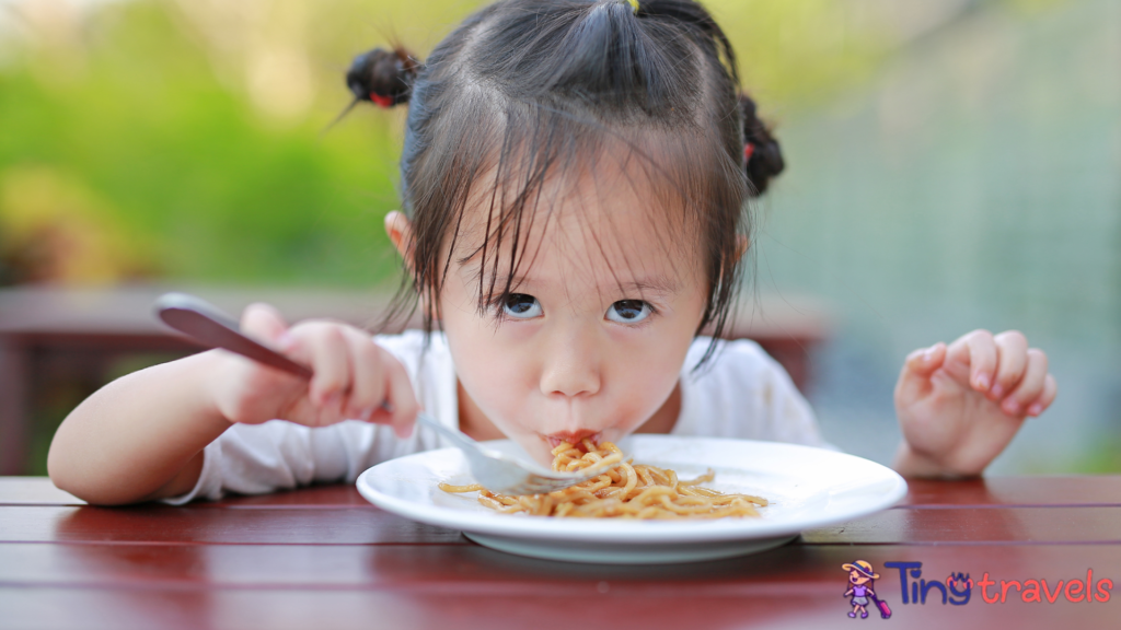 Kid girl eating Japanese yakisoba noodles.⁠
