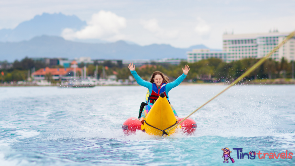 Banana boat ride. Kids on the beach.⁠