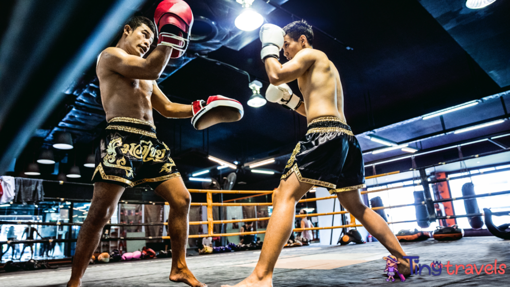 Muay Thai match on boxing ring 