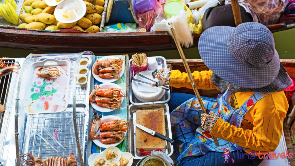 Floating food stall with seafood at Amphawa Floating Market⁠