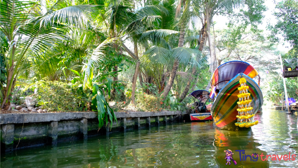 Bangkok, Thailand - June 25, 2018: Boats parking near the palm tree at Khlong Lat Mayom floating market,Thailand.⁠