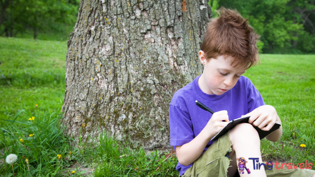 Happy Child Writing in a Journal Outside⁠
