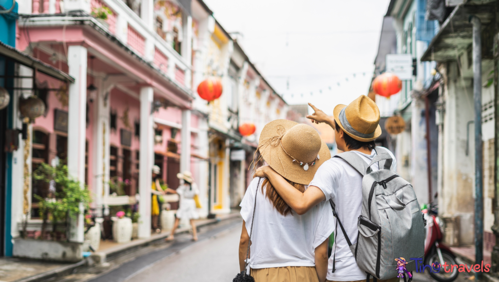 Young couple traveler walking at Phuket old town in Thailand⁠