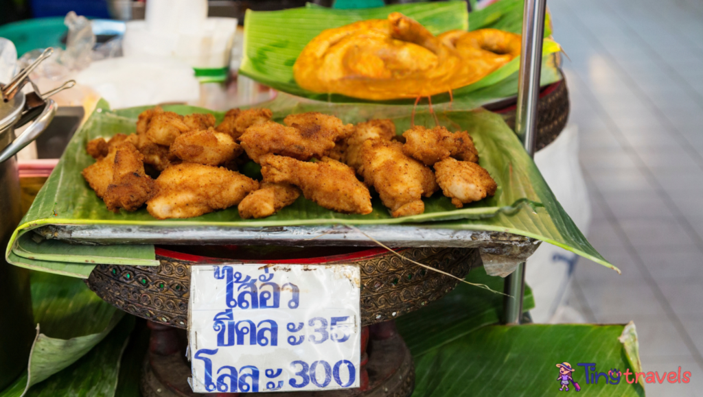 OR Tor Kor farmers market in Bangkok. Sausage & Chicken fry for sale.⁠