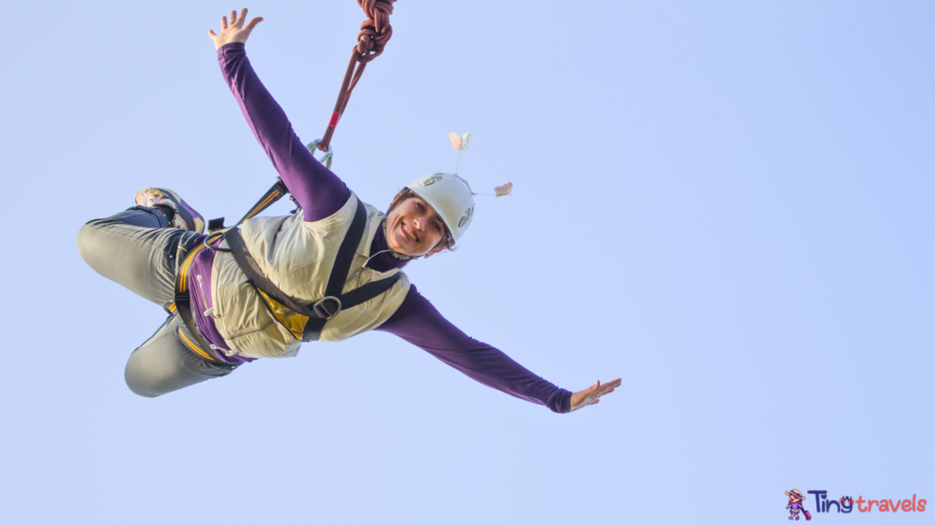 Woman Bungee Jumping Against Clear Blue Sky⁠