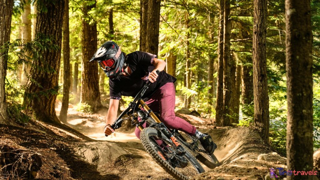 Man Mountain Biking in Forest⁠