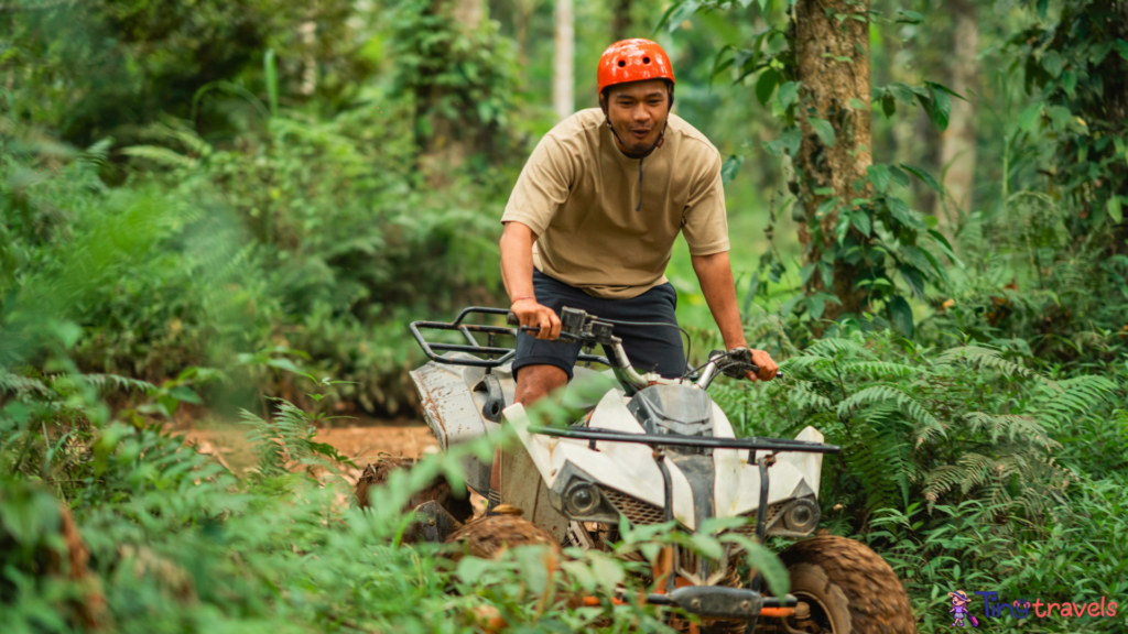 happy asian man fastly riding the atv through the atv track⁠