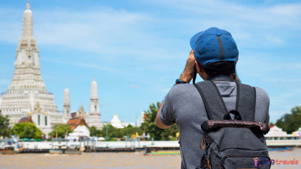 Asian Solo Tourist and Photographer Take Photo at Wat Arun Temple in Bangkok Thailand.⁠