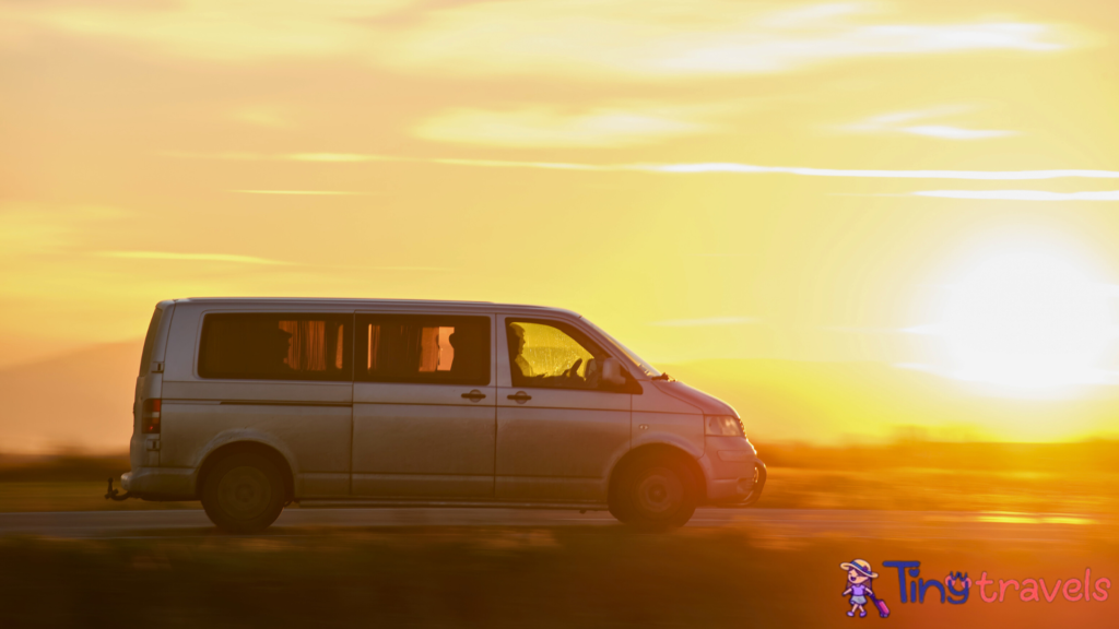 Passenger Van Driving Fast on Intercity Road at Sunset. Highway Traffic in Evening⁠