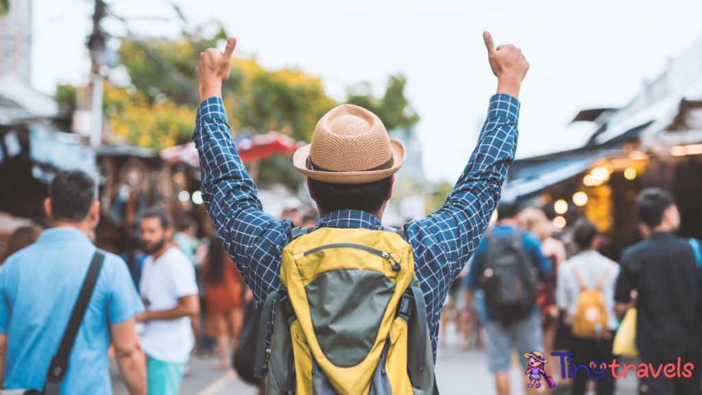 Traveling man walking at Chatuchak Market in Bangkok Thailand.⁠