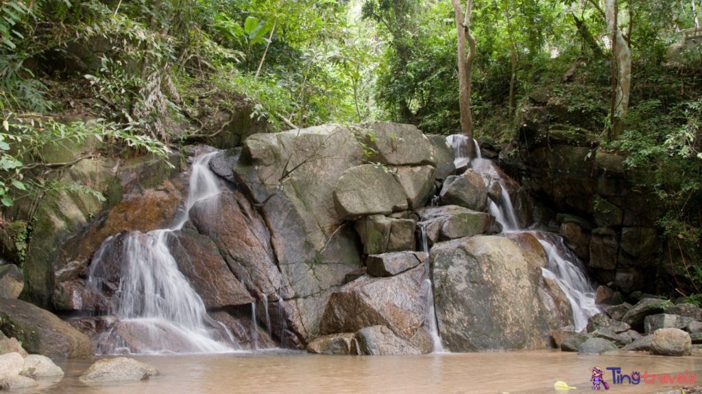 Kathu waterfall water gently flowing down the rocks Patong Phuket Thailand Asia⁠