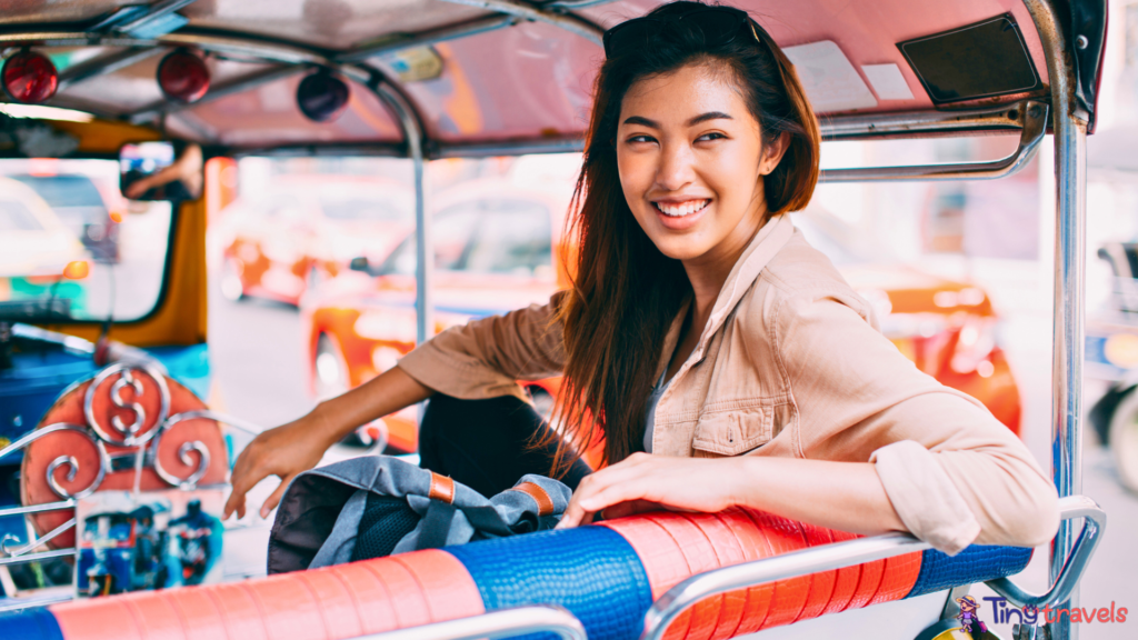 Young Woman Sitting at Tuk Tuk in Bangkok, Thailand⁠