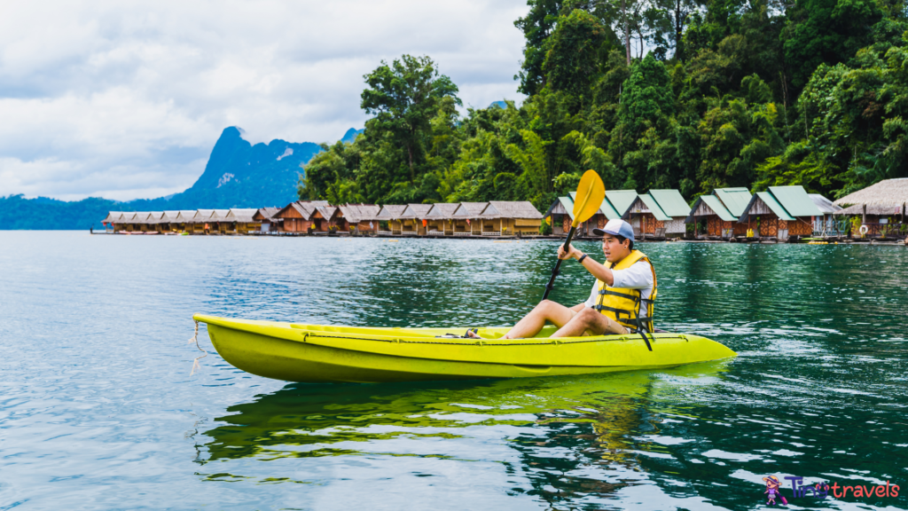 Vacations recreation activity kayaking with floating raft resort, Thailand⁠