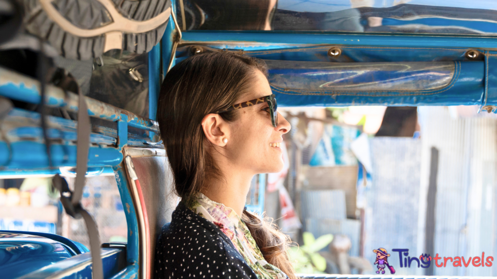 Woman backpacker traveling in public transport in Thailand.⁠